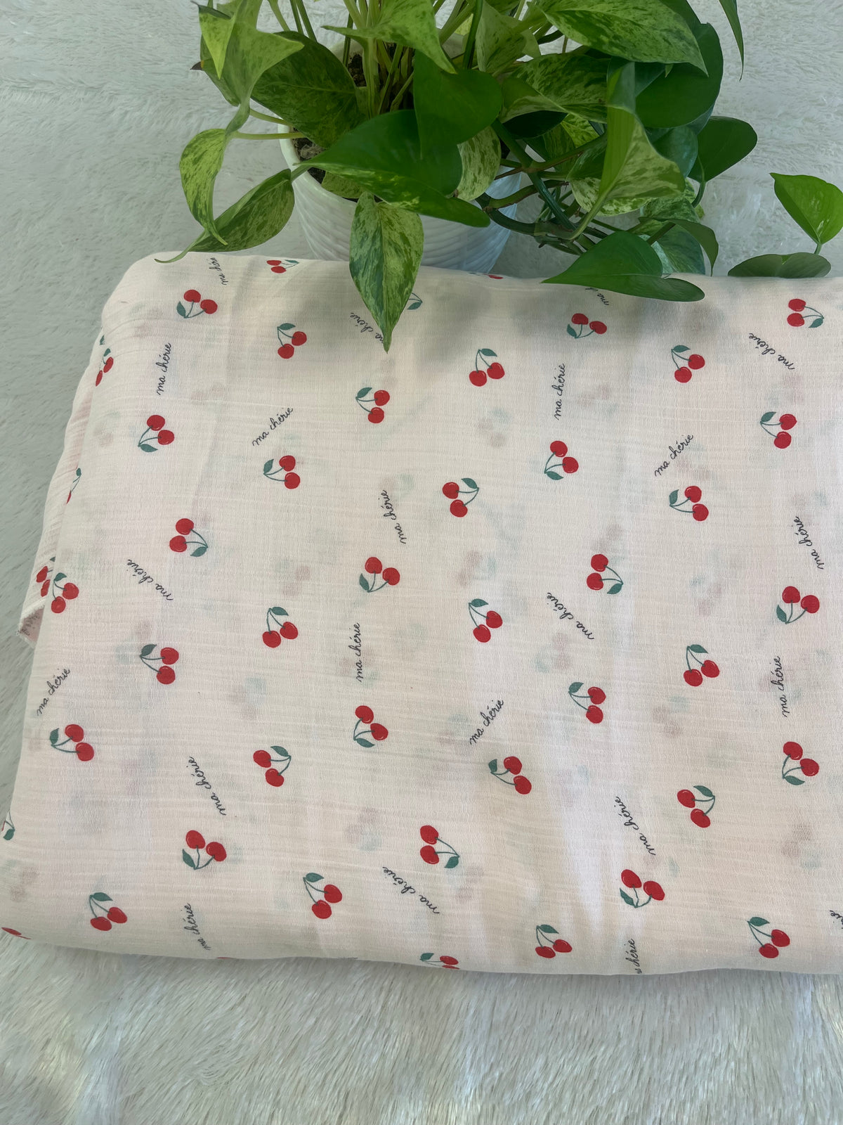 pink muslin fabric with cherry design