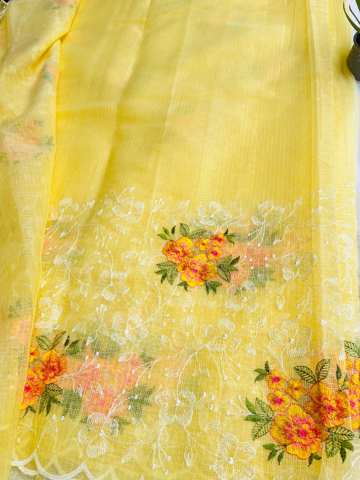 Cute lemon yellow net kota saree with flower embroidery work