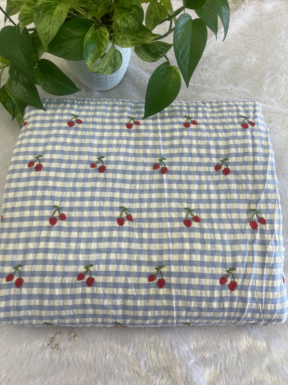 Blue shade check fabric with cherry design