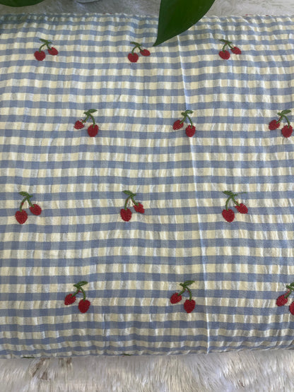 Blue shade check fabric with cherry design