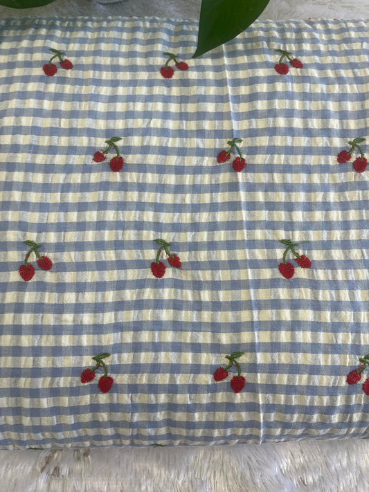 Blue shade check fabric with cherry design