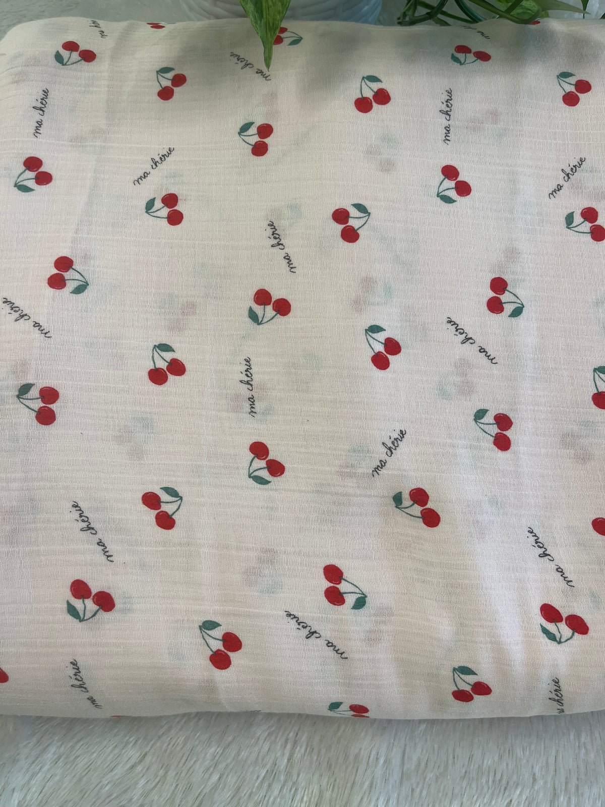 pink muslin fabric with cherry design