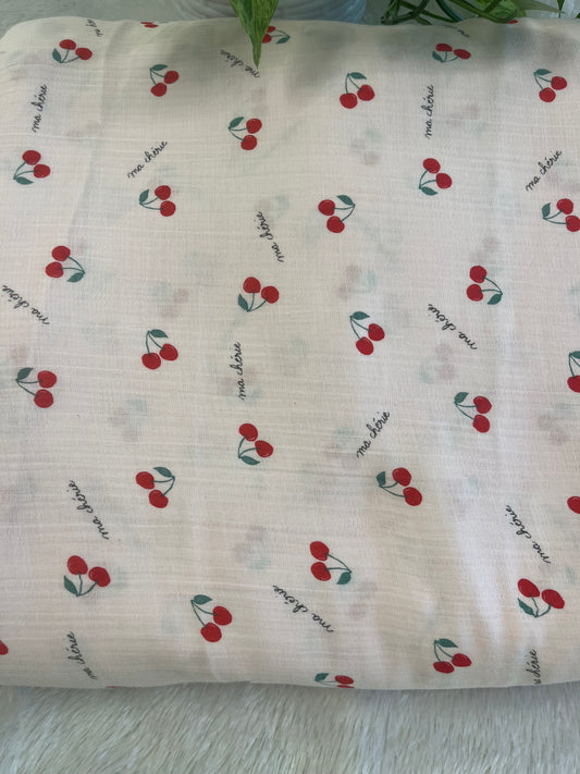 pink muslin fabric with cherry design